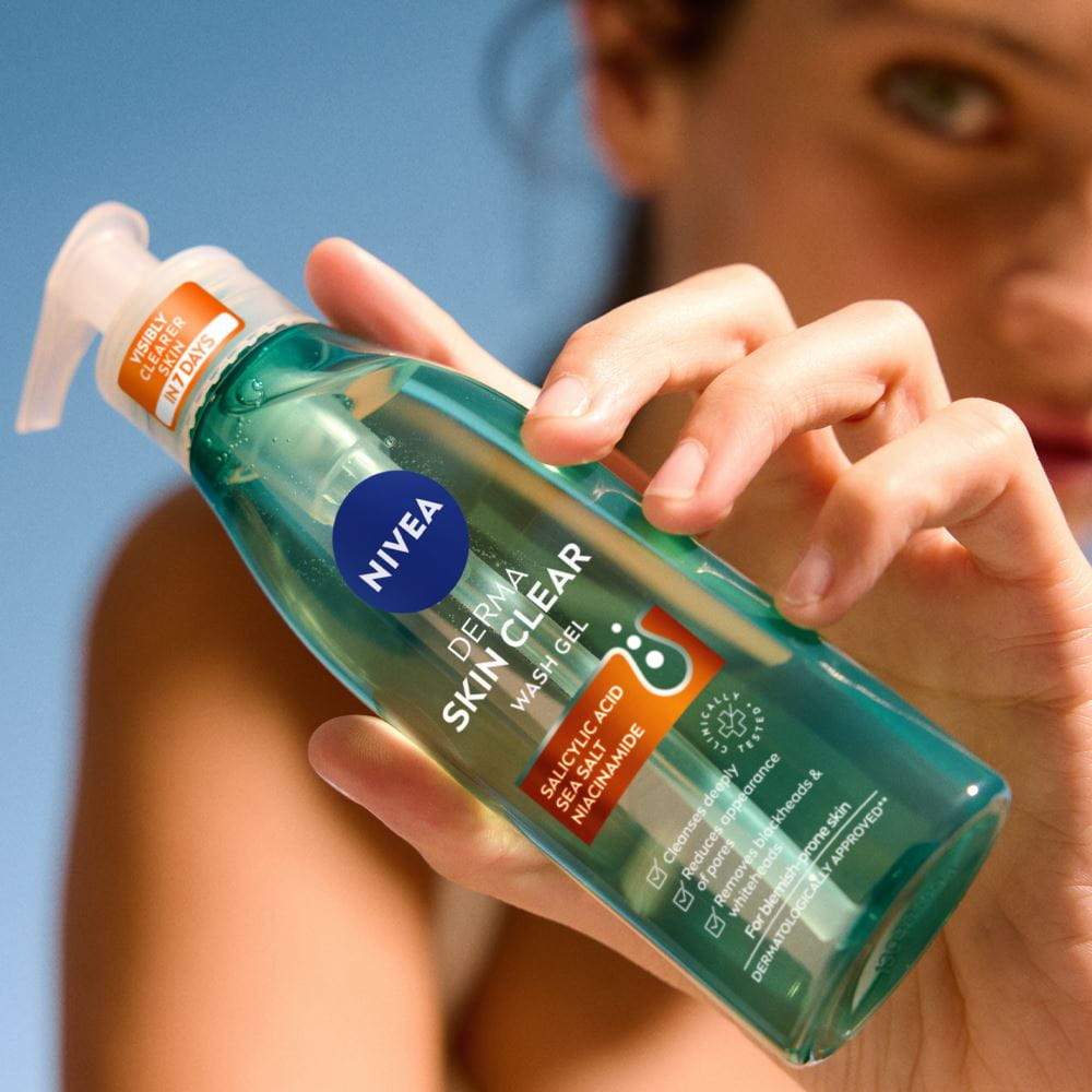 Nivea Skin Clear Wash Gel sitting on a tile bathroom counter next to a sink.