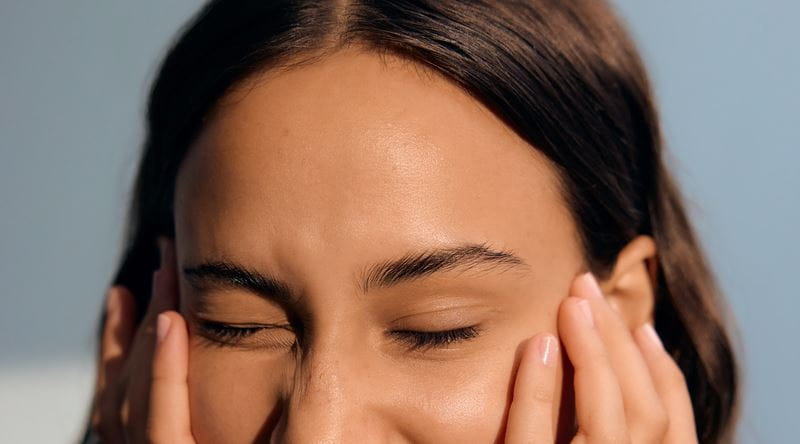 Woman sitting with her arms crossed