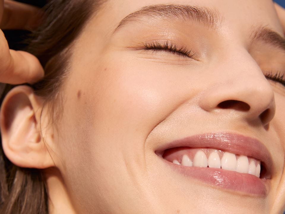 woman scrubbing her face
