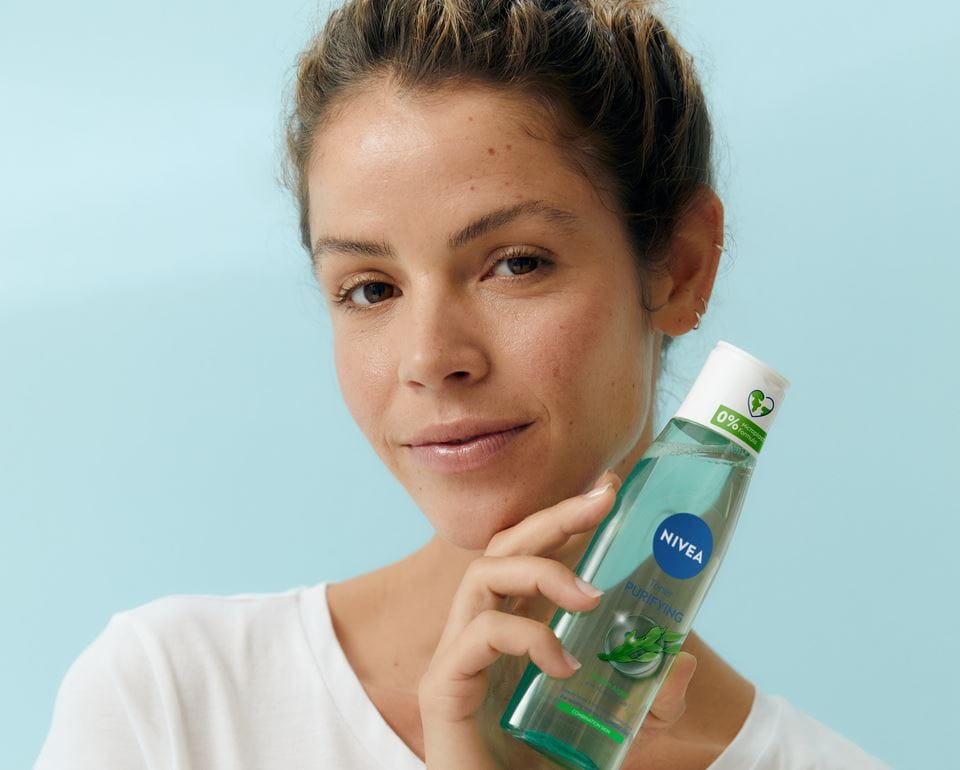 young woman using Nivea washing gel