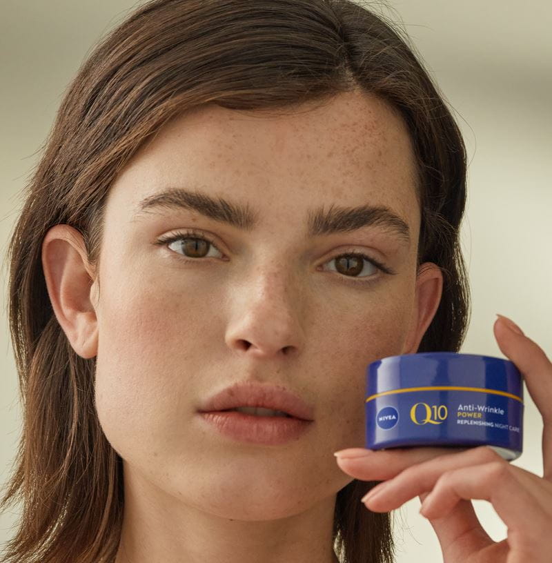 woman using q10 anti wrinkle night cream