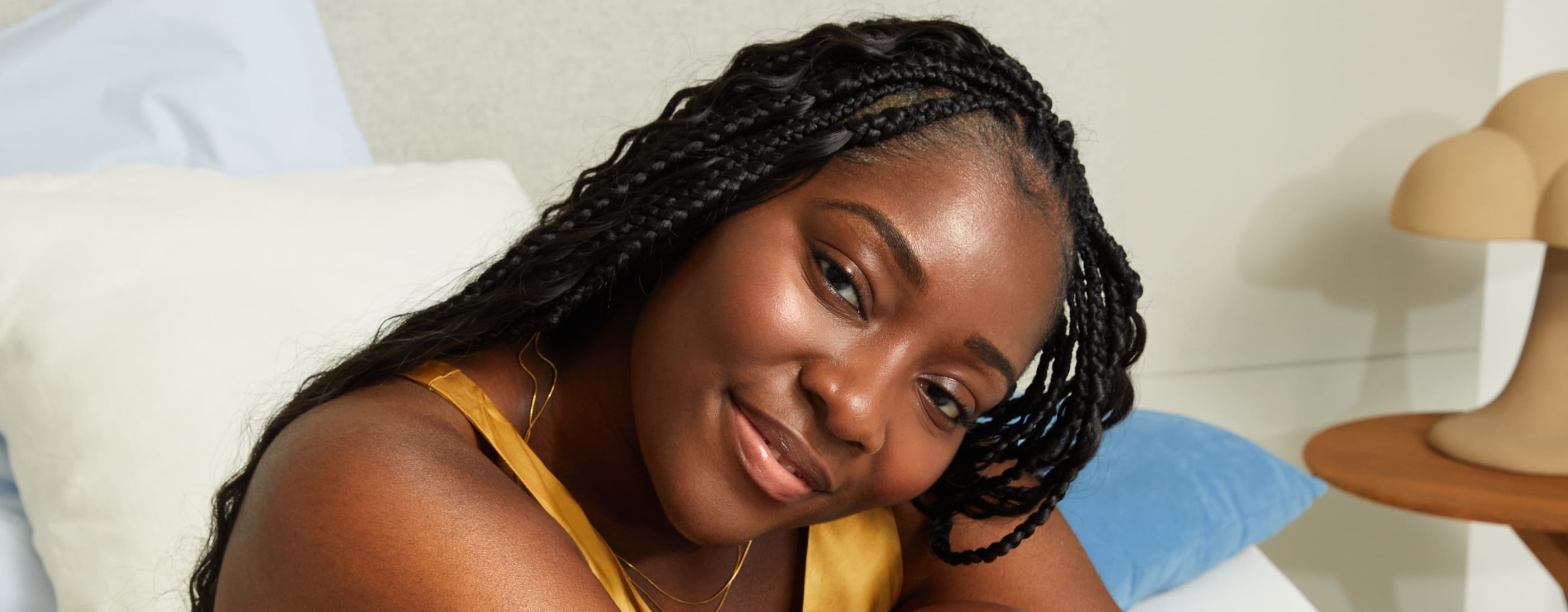 Young woman using Nivea Skin Firming body lotion