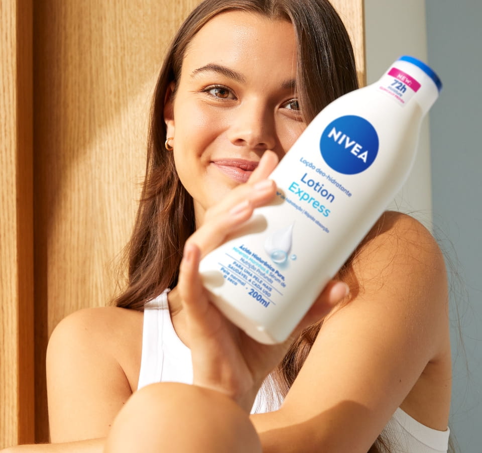 Young woman using Nivea Lotion Express