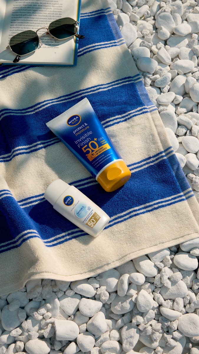 girl applying Nivea SPF spray