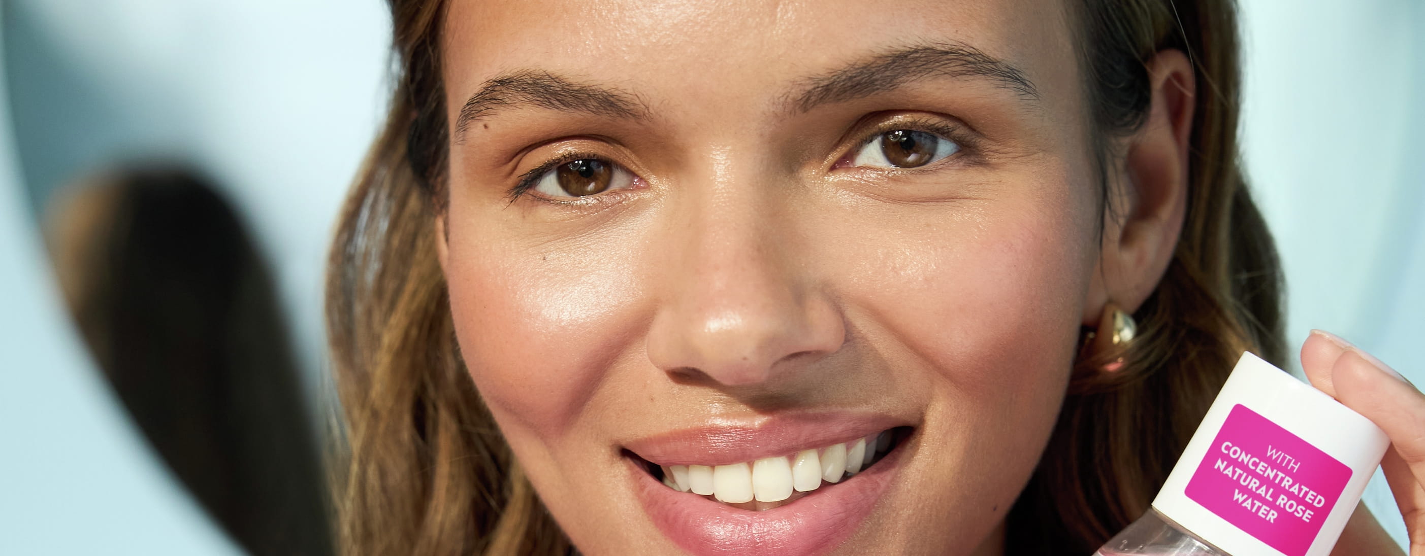 Young woman using Nivea Micellar water Rose Care
