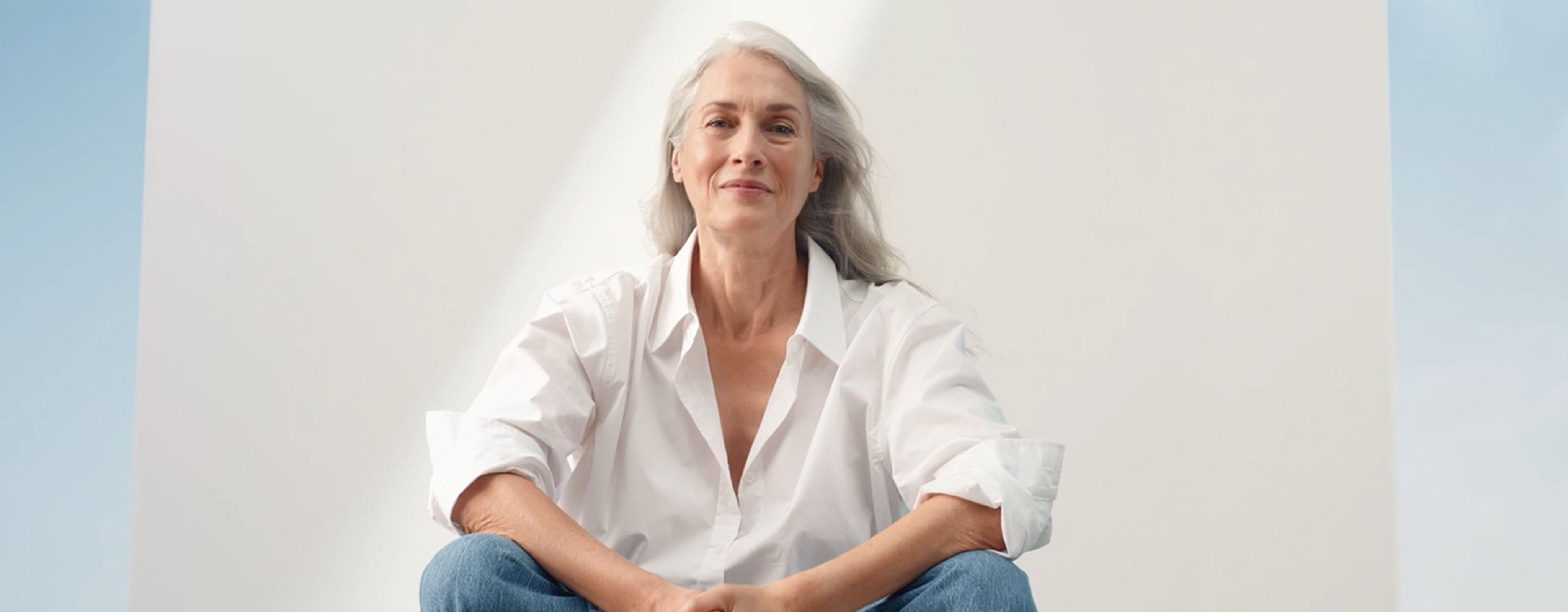 A couple smiling beside NIVEA Derma Skin Clear products banner highlighting Niacinamide and Salicylic Acid for blemish‑prone skin.