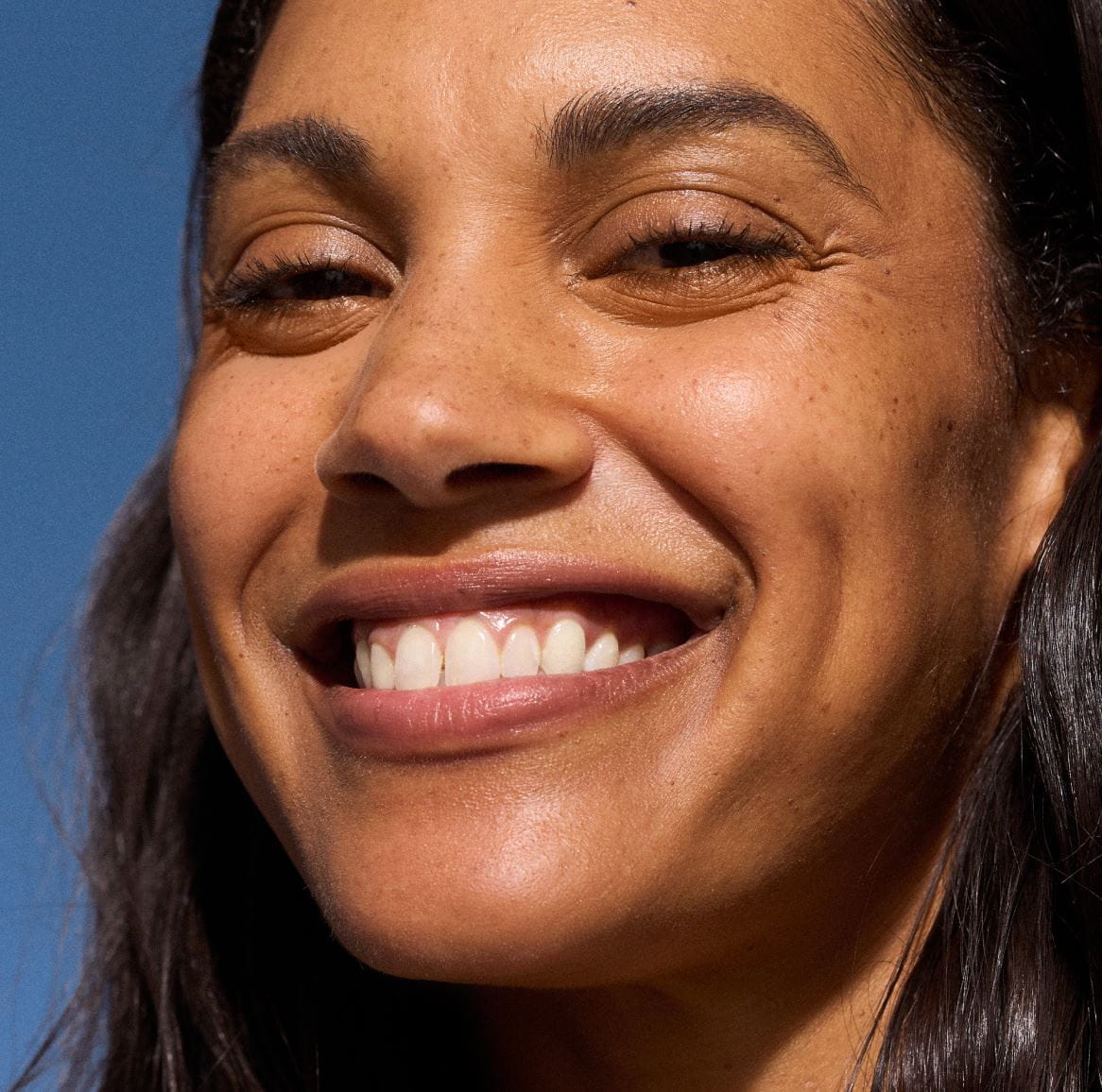 brunette women smiling with freckles