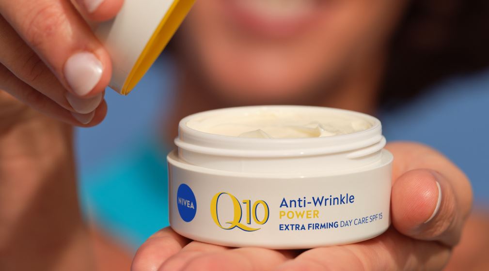 woman applying NIVEA Q10 power anti-wrinkle cream