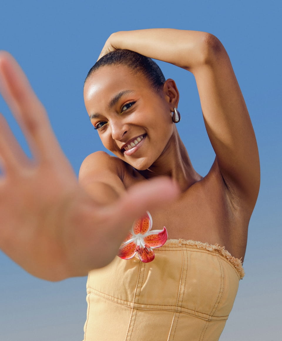 Young woman standing in the sun