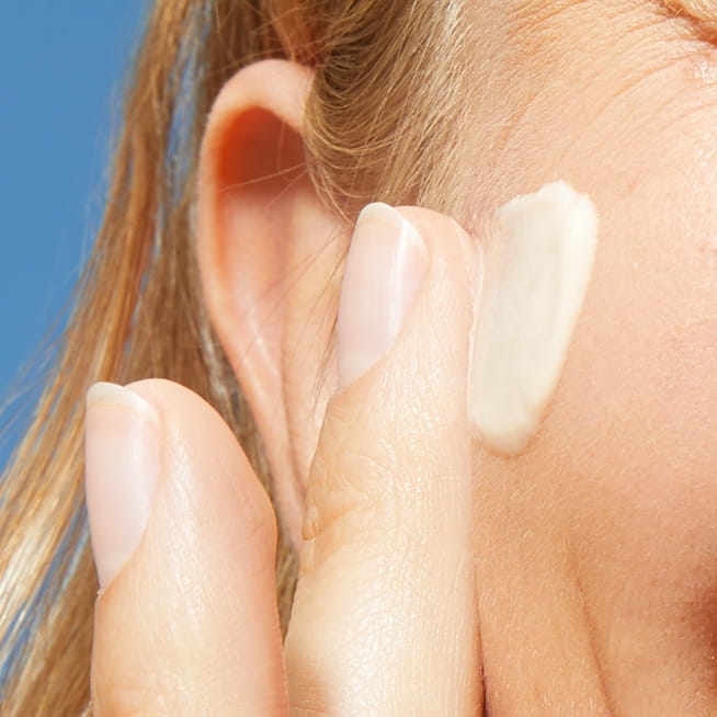woman applying sunscreen in step 3