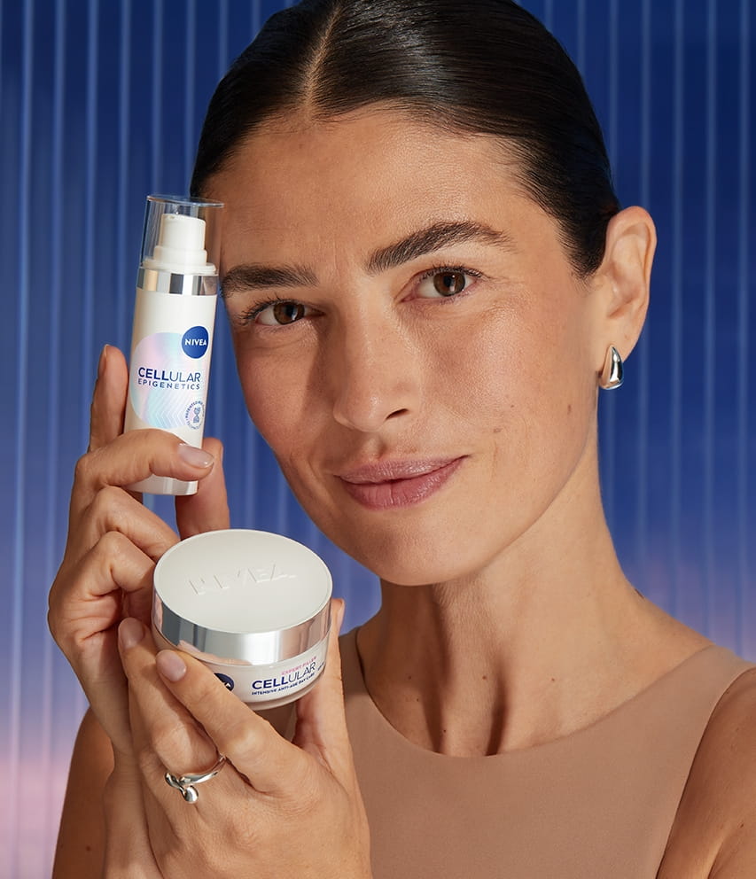 Young woman using Nivea Q10 Anti-Wrinkle Power face cream