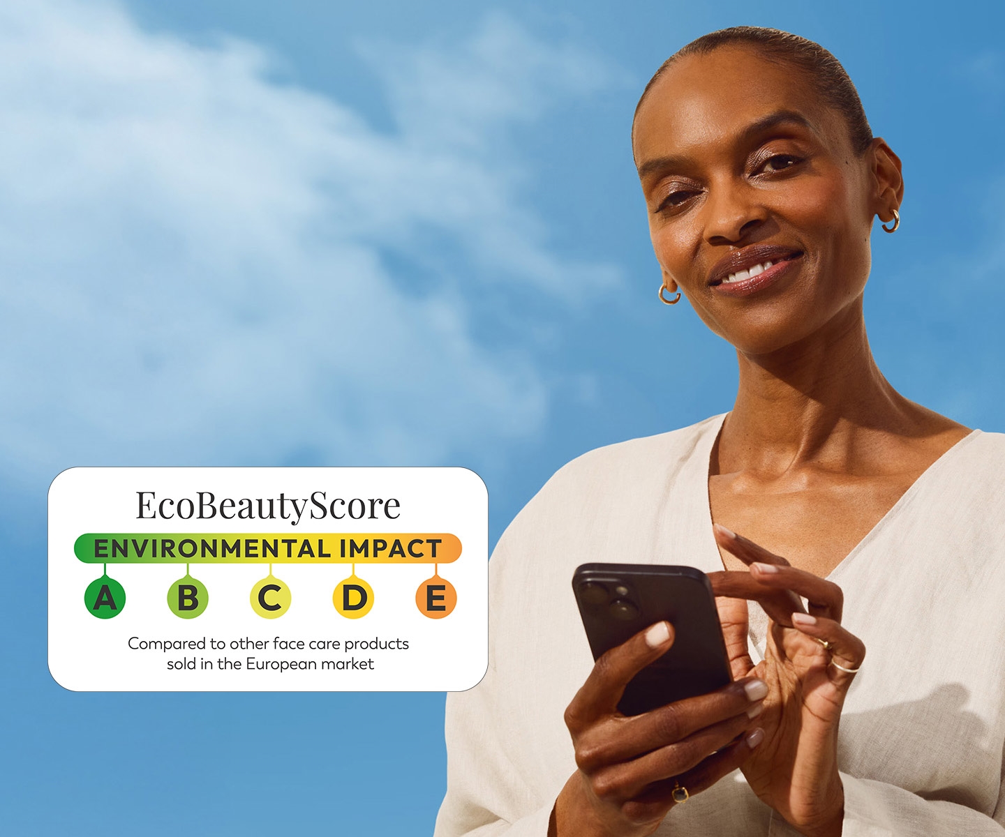Smiling woman with phone beside EcoBeauty Score label and sustainable skincare message.
