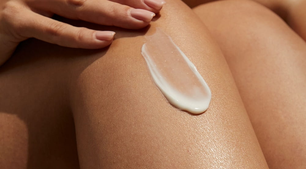 woman applying lotion
