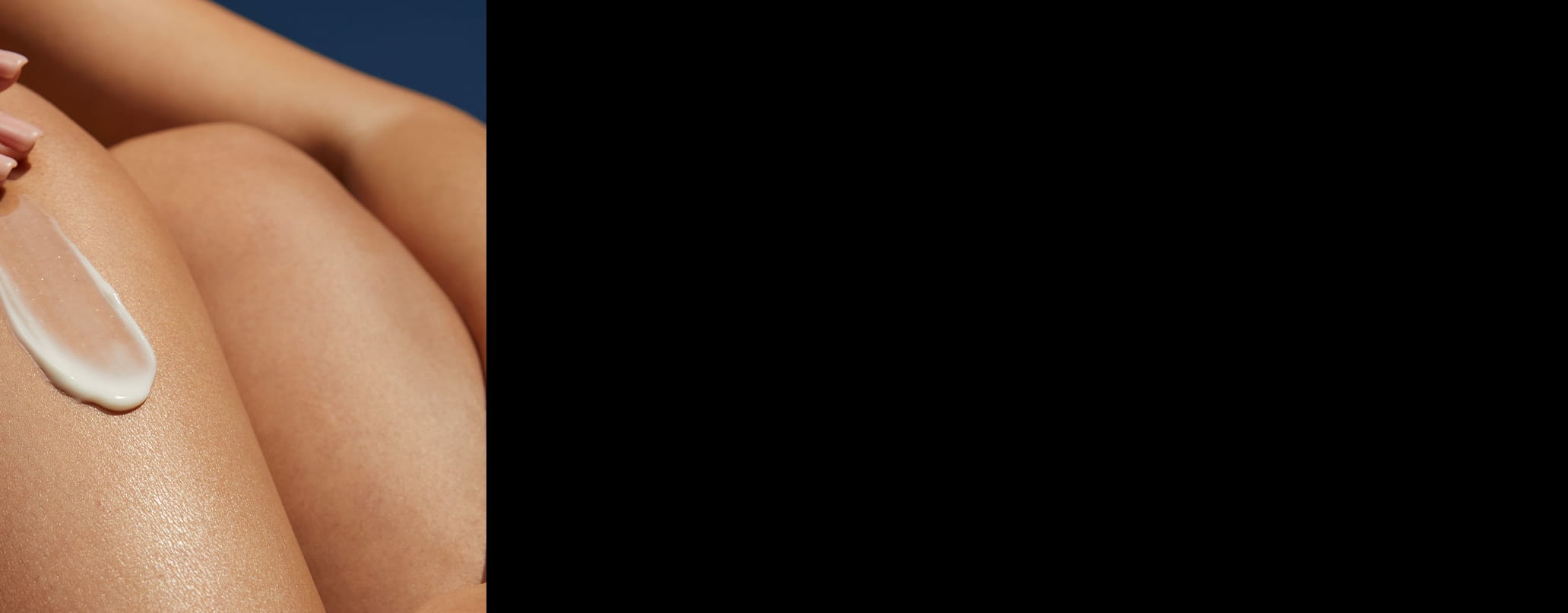 woman caring for baby with childrens sun cream