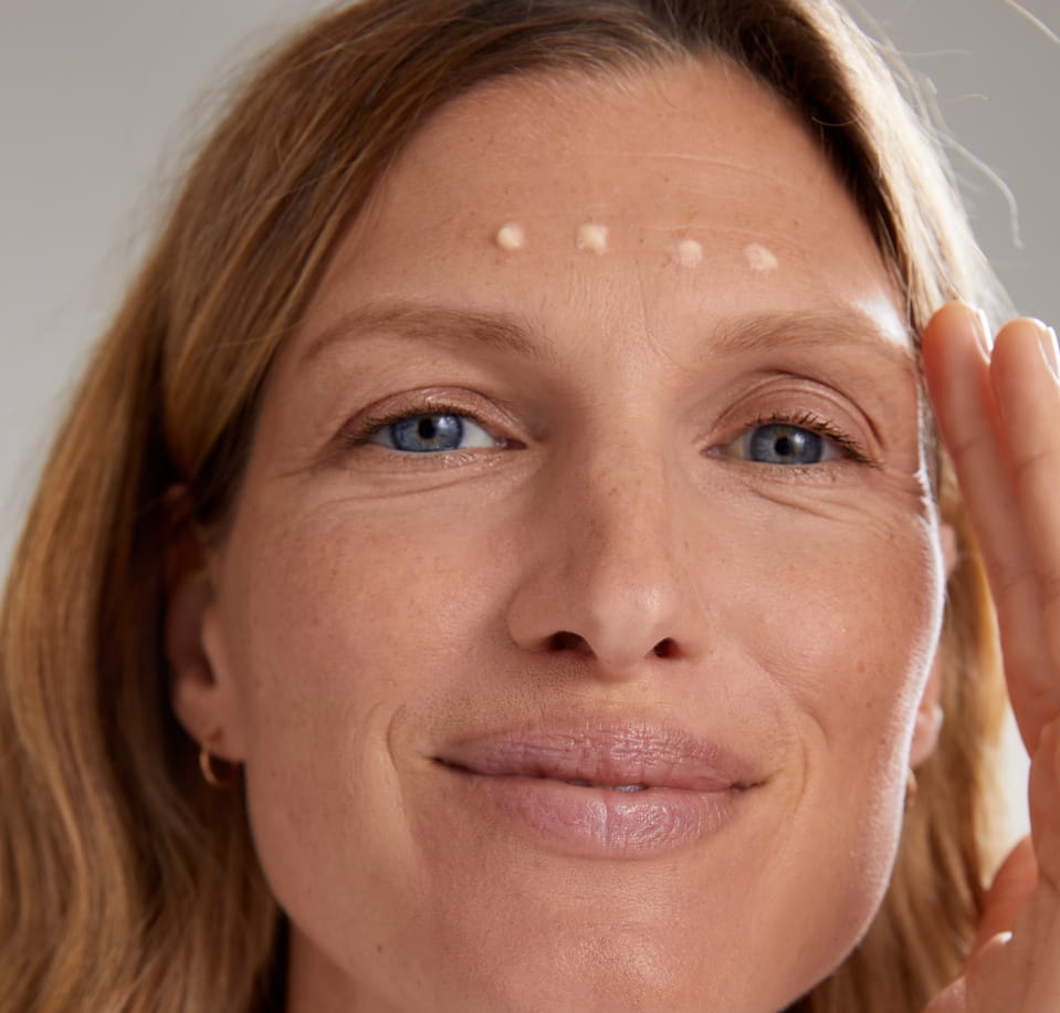 Woman Using Nivea Serum Filler for Frown Lines