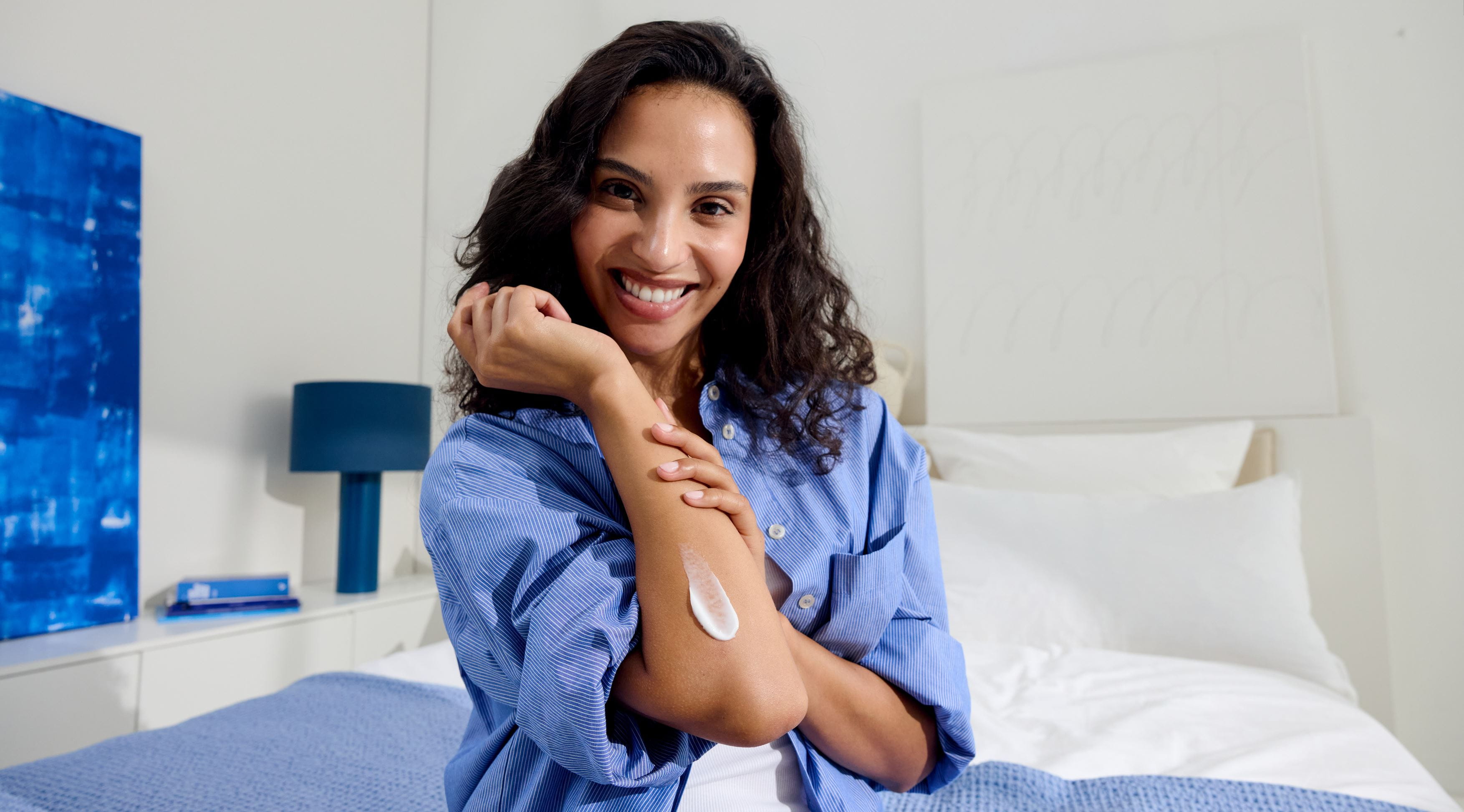 woman smiling hydrating skin