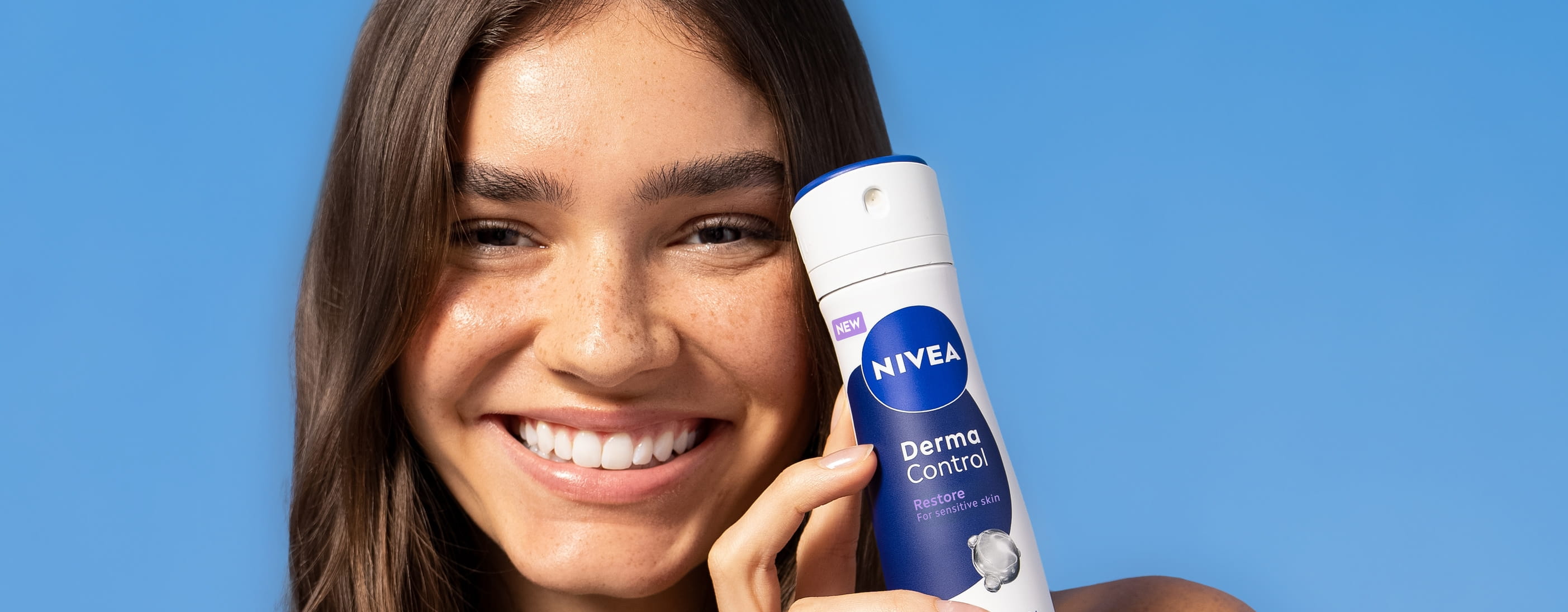 Young woman using Nivea Derma Control deodorant