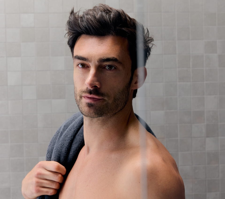 man holding 2 razors