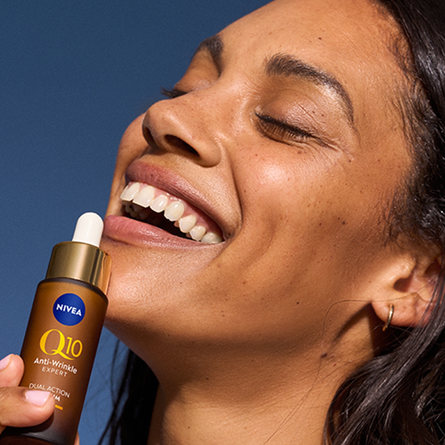 Young woman using Nivea Q10 anti-wrinkle serum