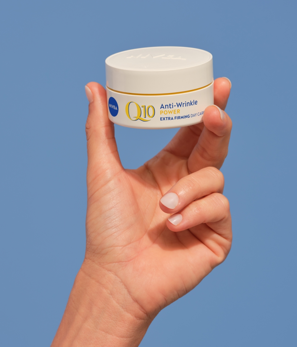 woman applying NIVEA Q10 power anti-wrinkle cream