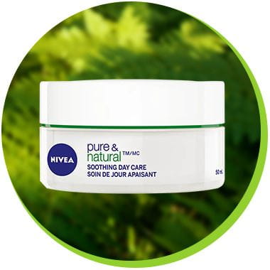 A NIVEA Pure & Natural Soothing Day Care cream product against a leafy-green background.