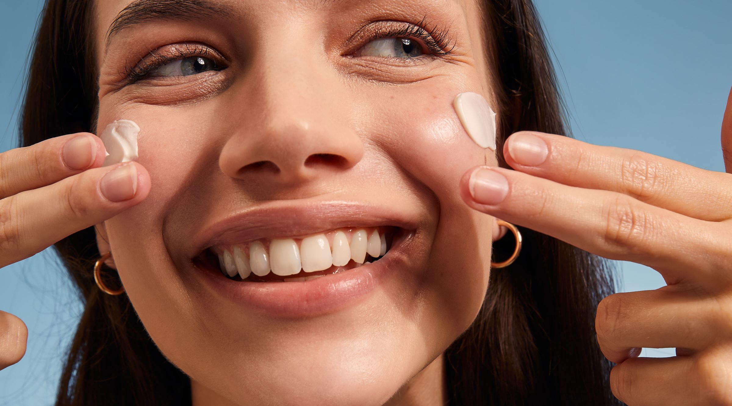 woman with sunscreen on her face