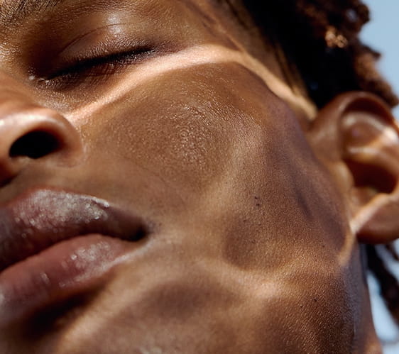 man applying Nivea serum on his face