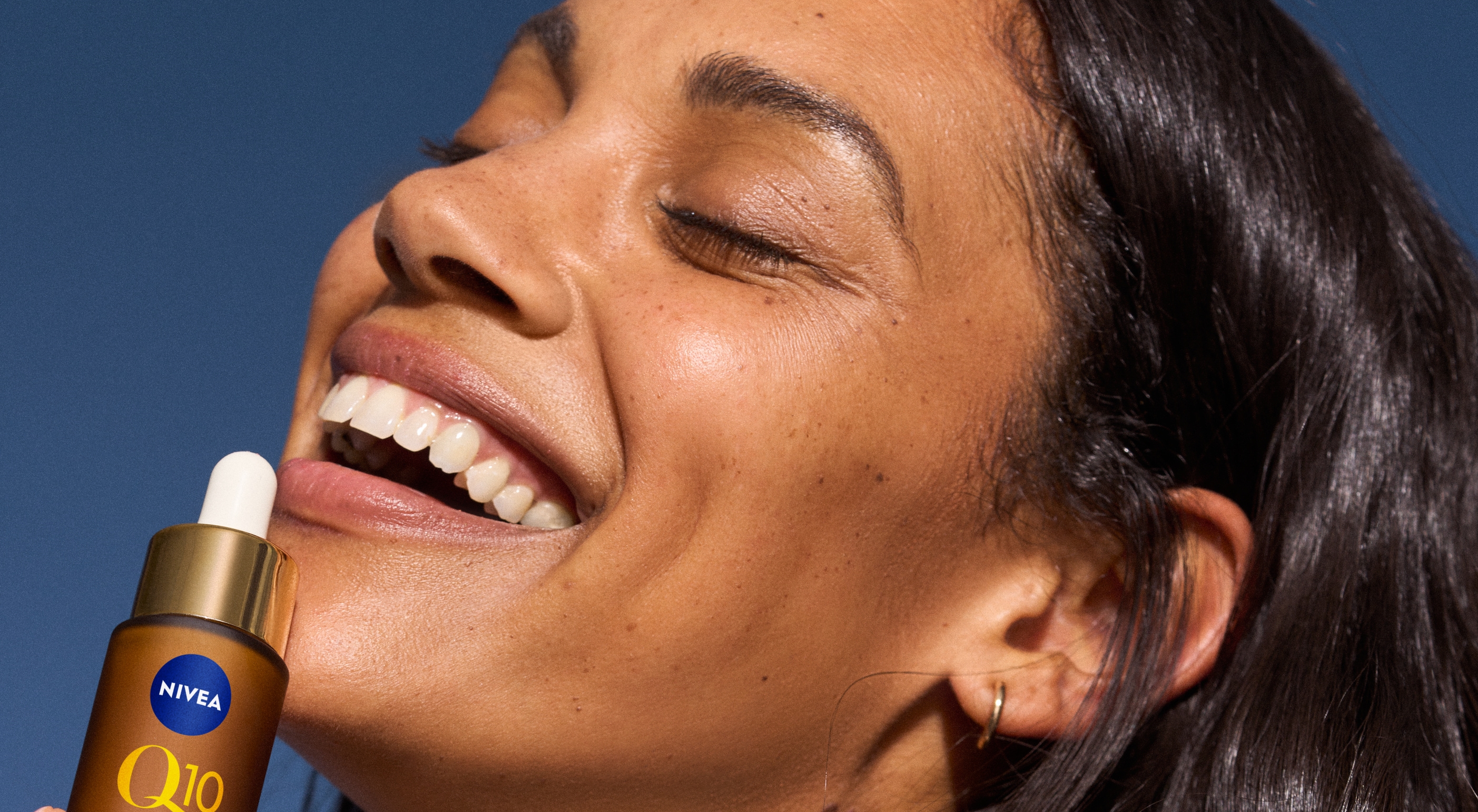 Young woman applying Q10