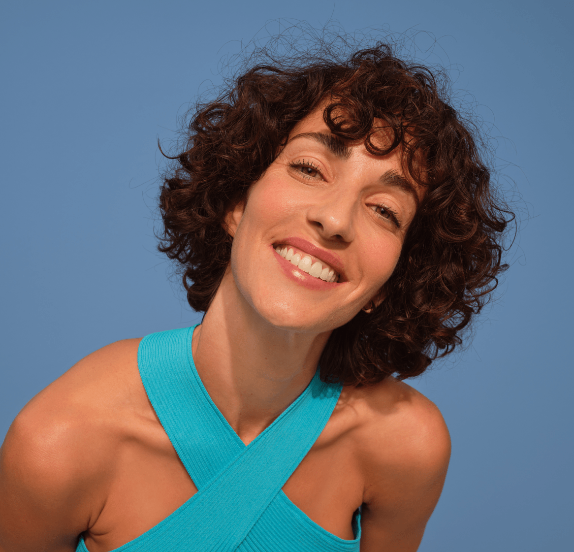 woman holding a Nivea Q10 Anti Wrinkles face cream