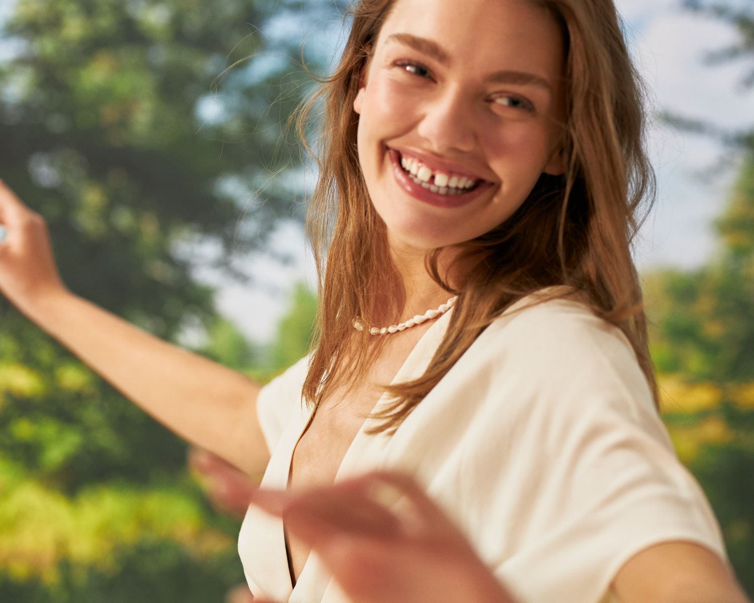 woman applying vegan skincare body lotion