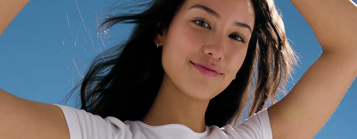 woman with her arms raised