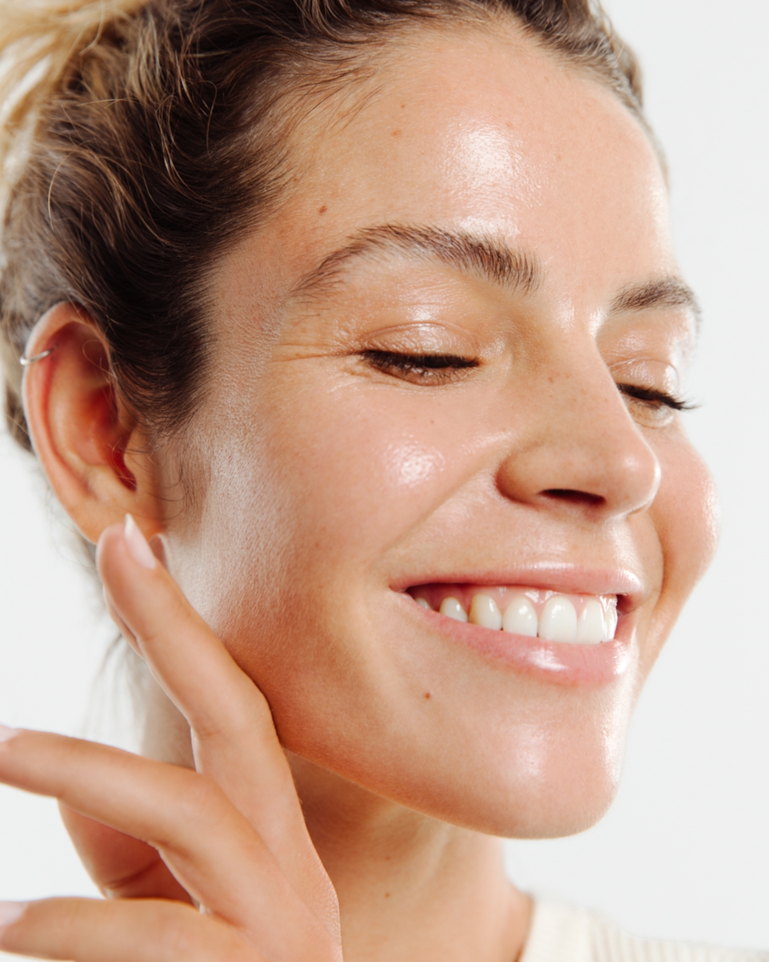 Smiling woman with glowing skin