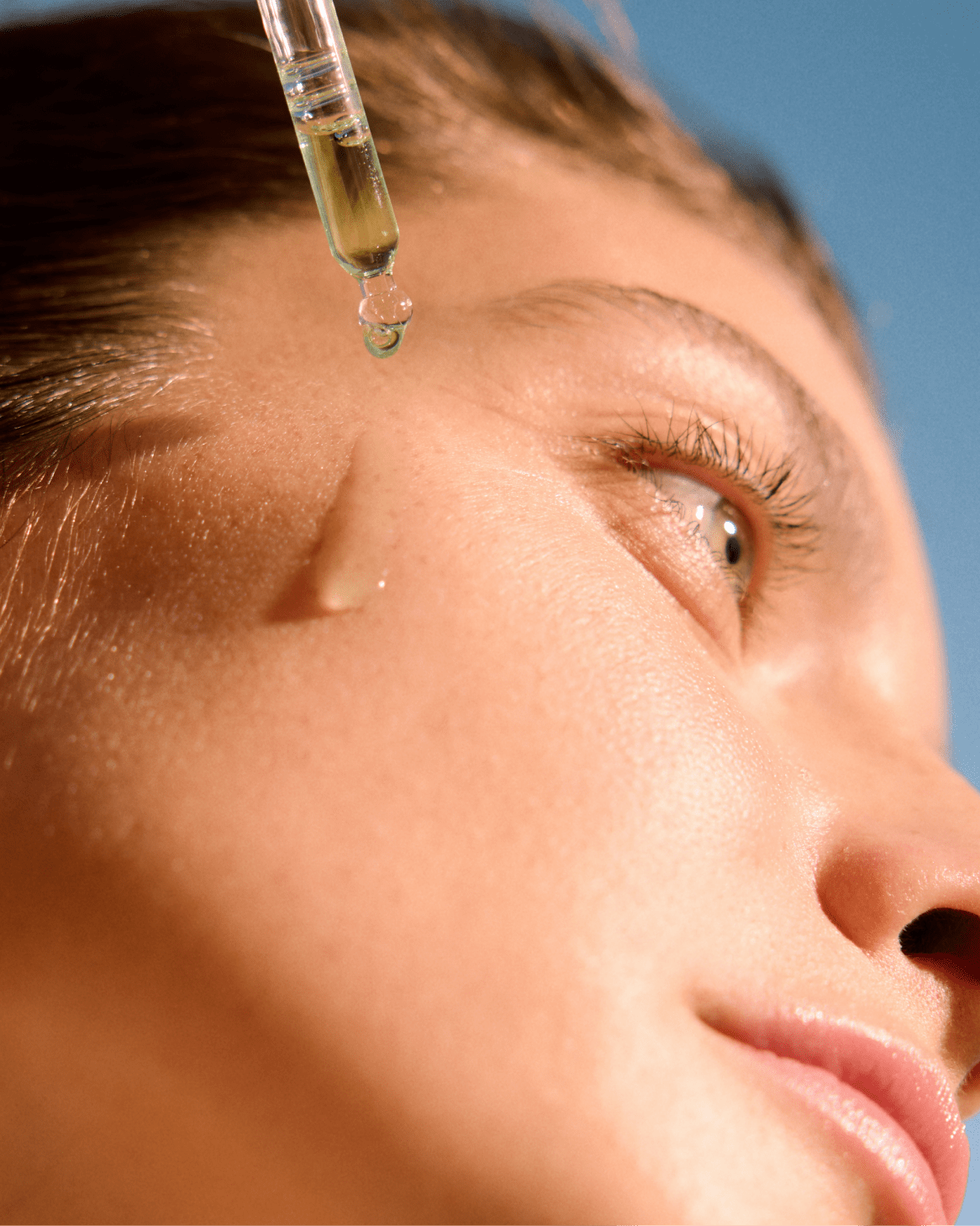 woman holding a Nivea serum