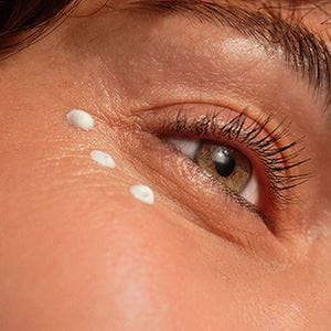 woman applying eye cream
