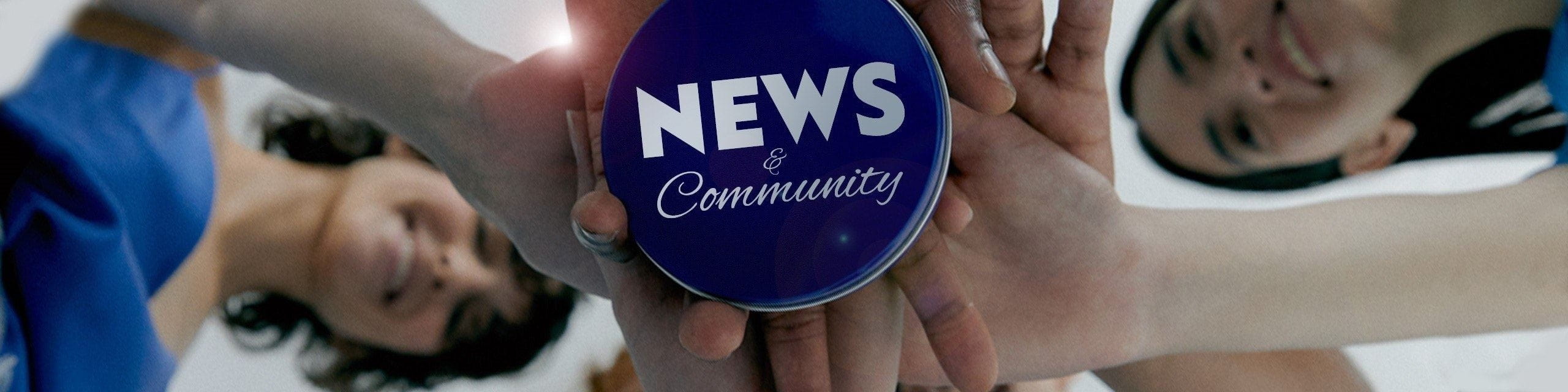 Hands holding a blue circle with 'NEWS & Community' text.