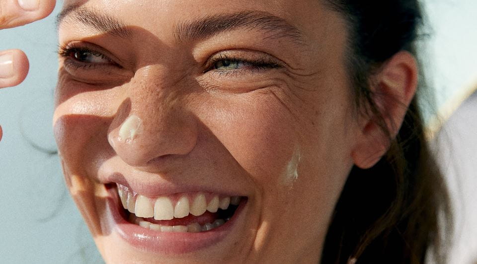 woman with Nivea serum on face