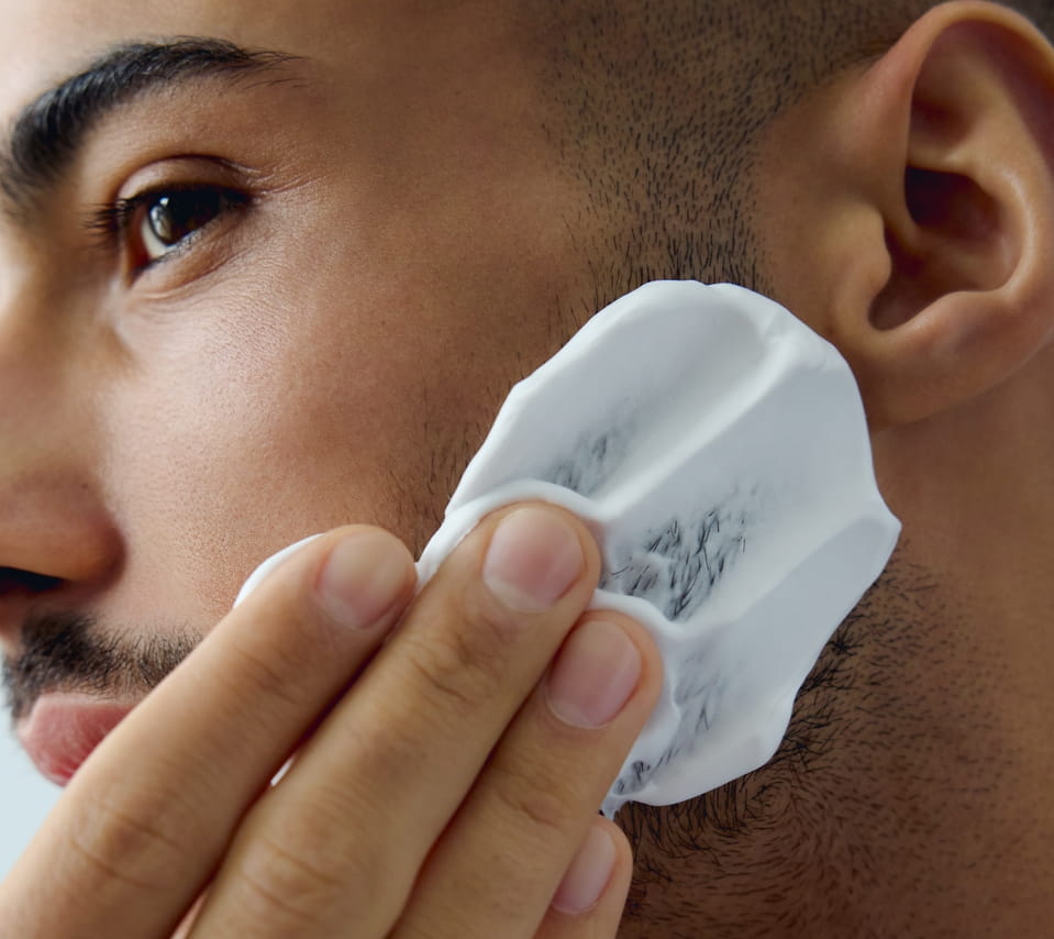 man shaving face