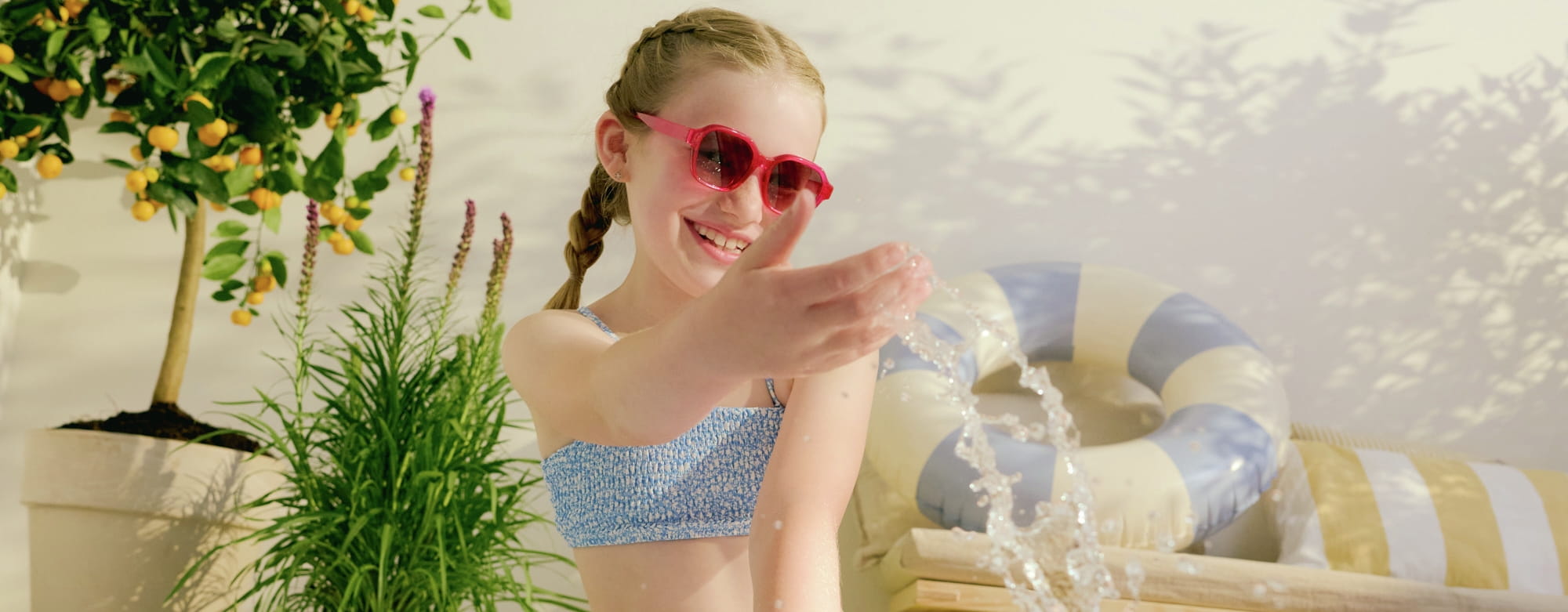 Girl smiling beside the pool