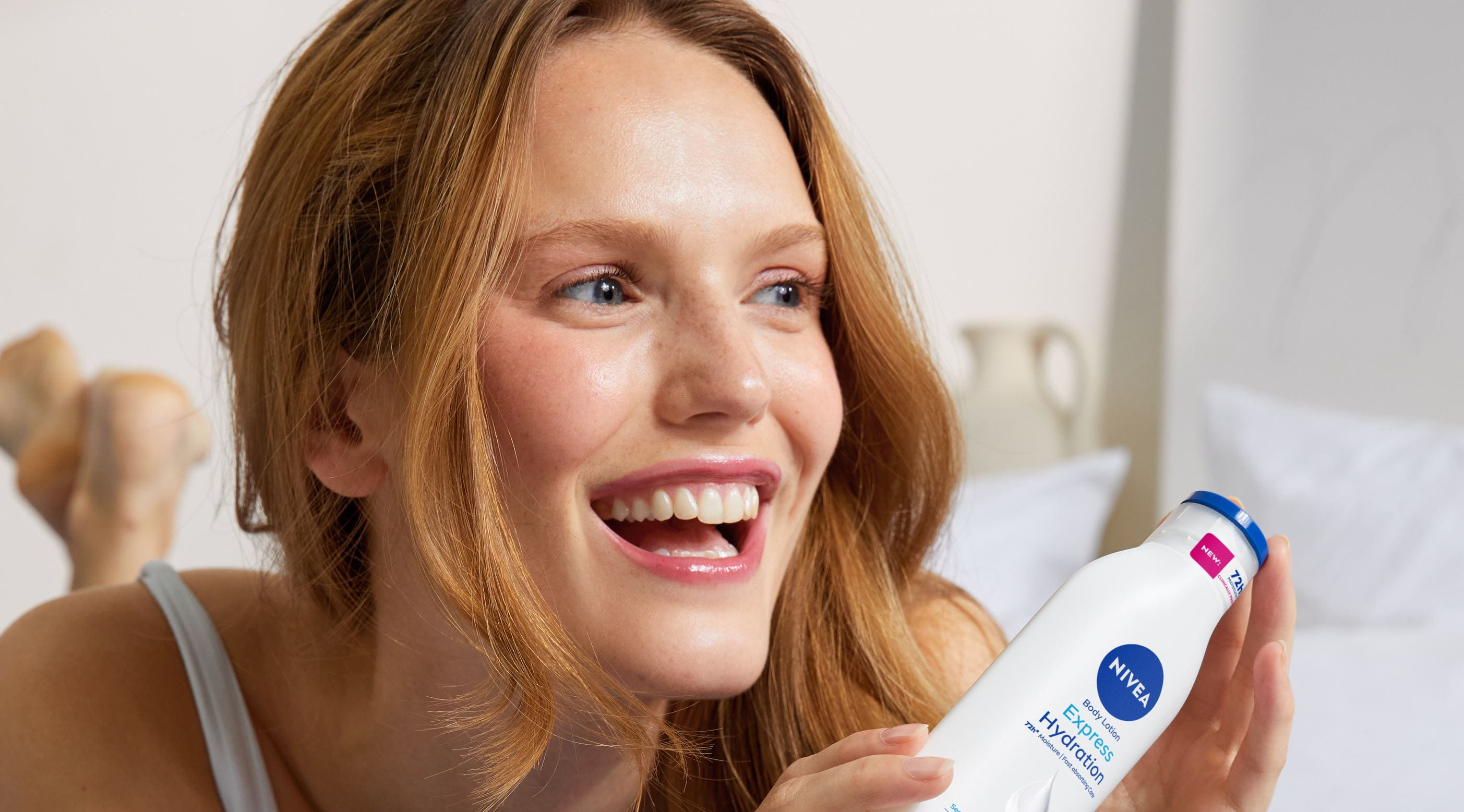 young woman using Nivea Express Hydration Body Lotion