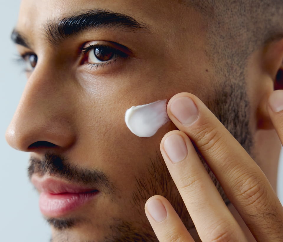 man with moisturiser