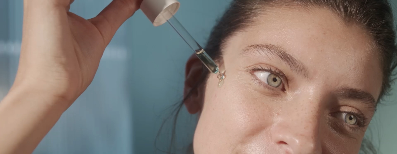 woman applying nivea rebalance and clear serum for blemish free skin