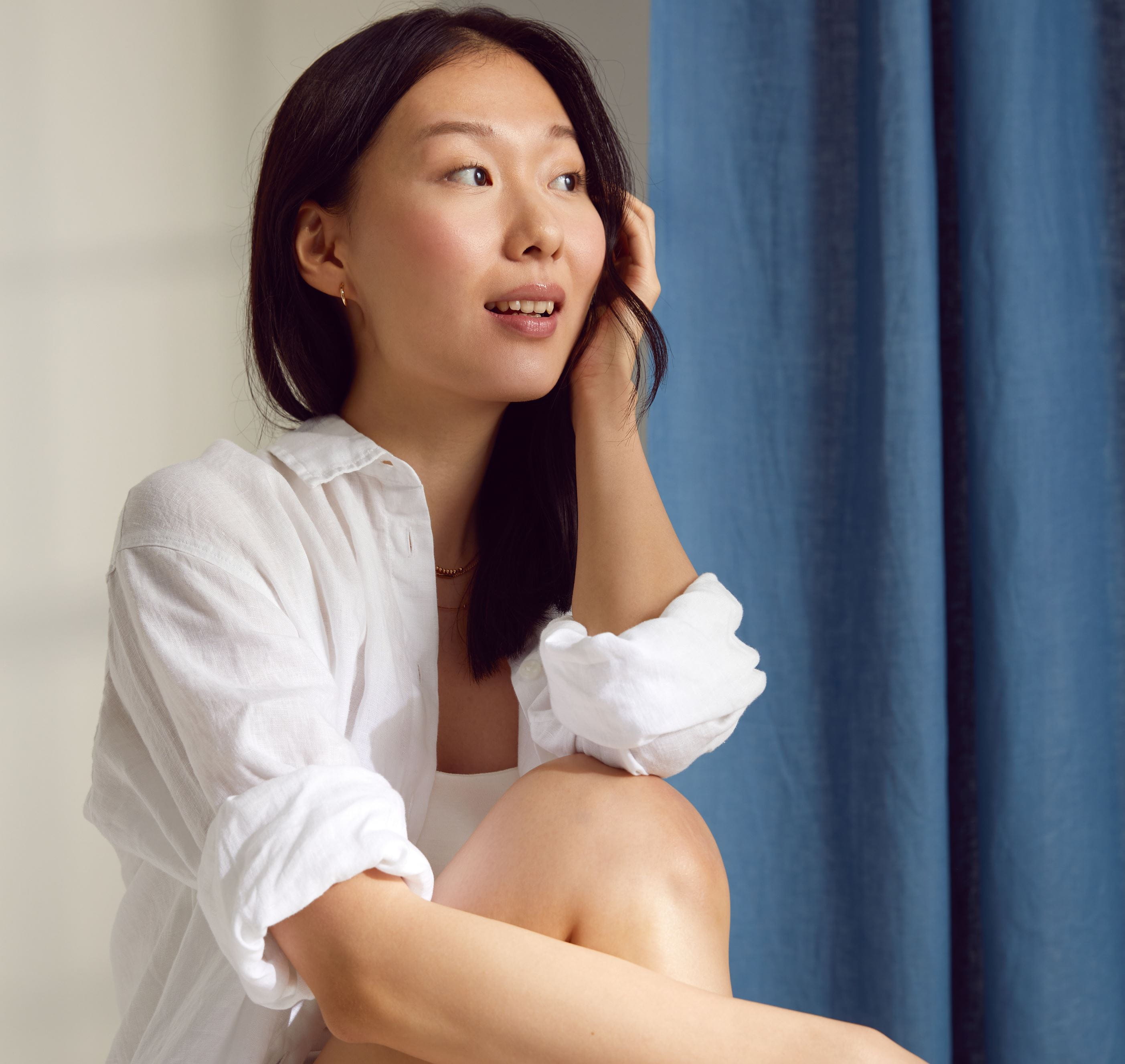 woman applying Nivea face cream