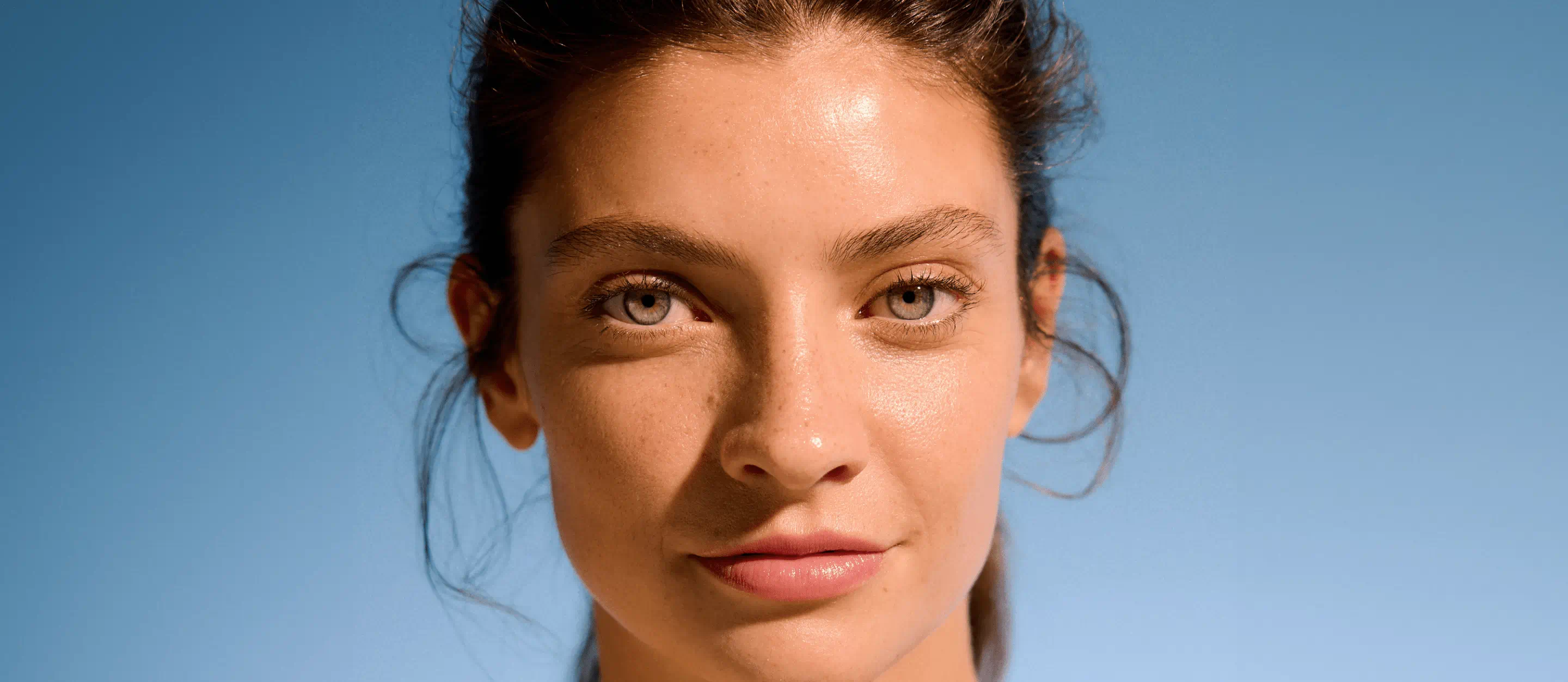 confident looking woman with blemish free skin