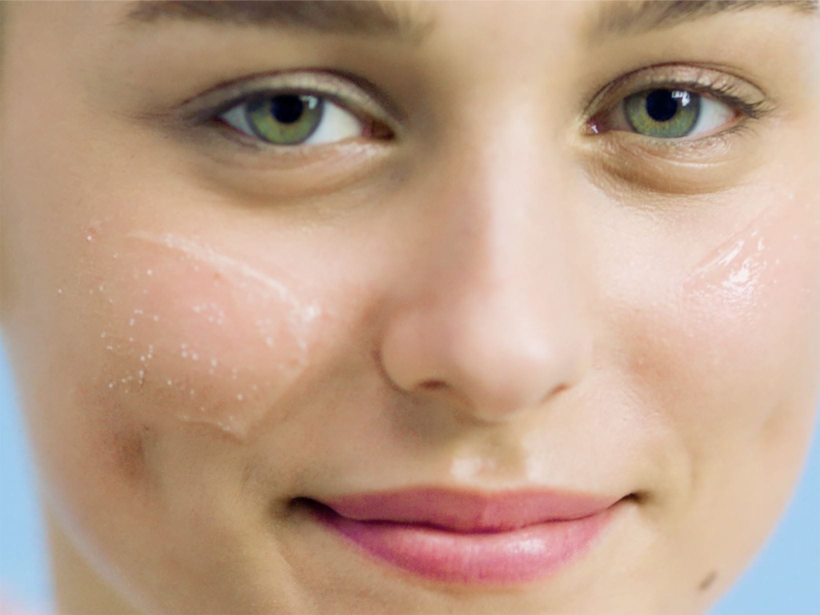 lady with face cream on her cheeks