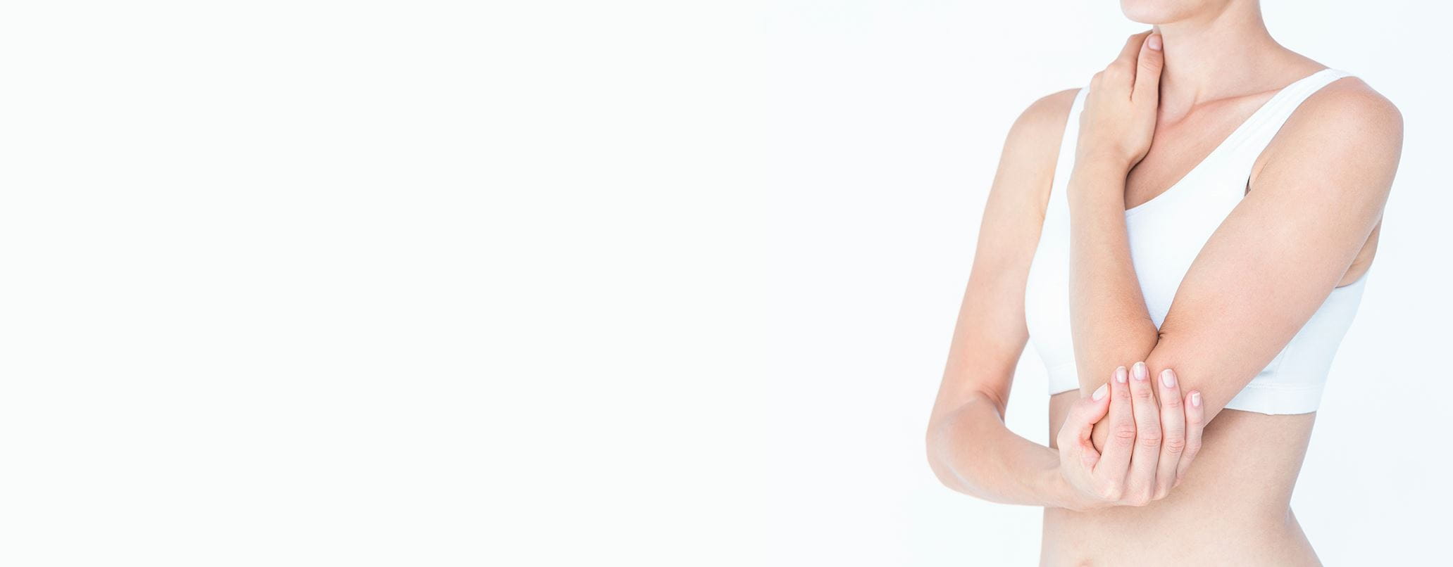 woman holding her elbow