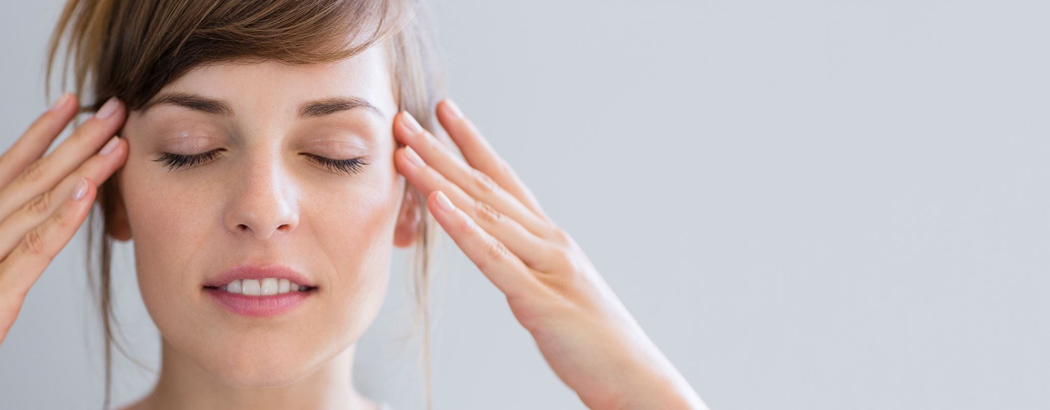 woman with her eyes closed and nice skin
