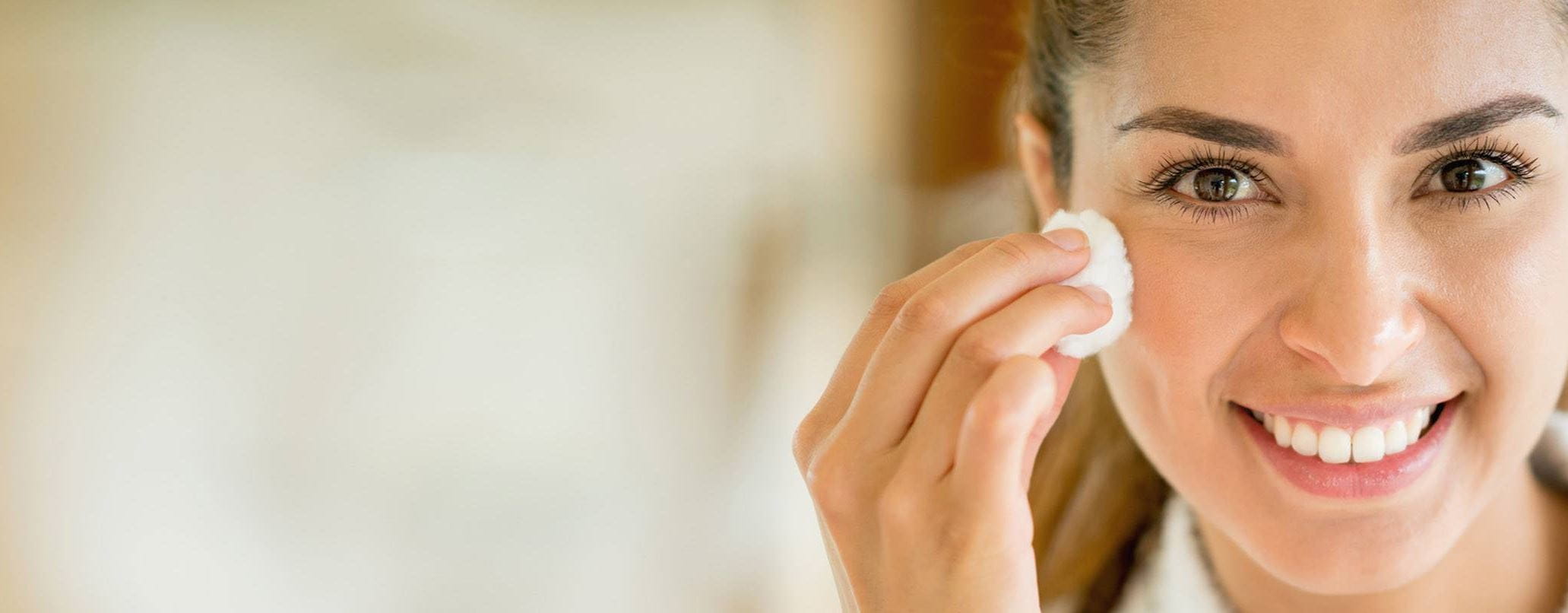 woman using a dry oil based makeup remover