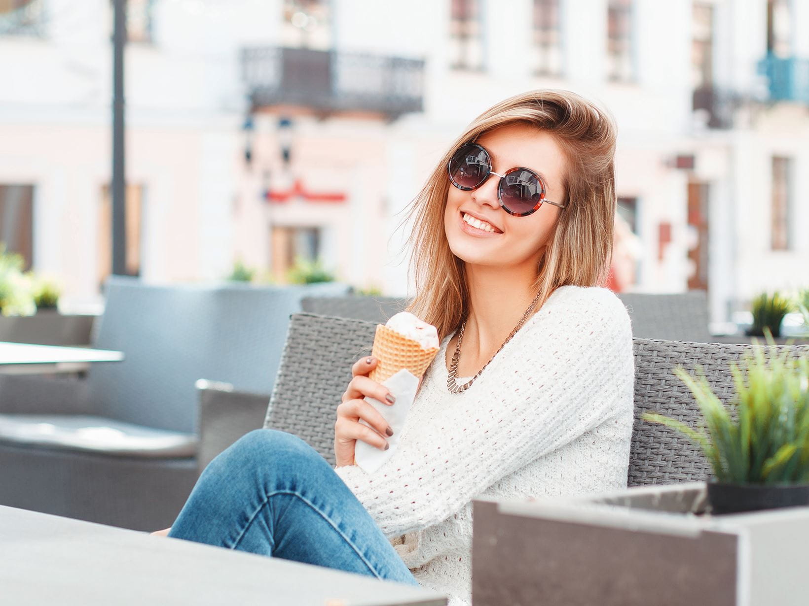 fashionable-woman-with-sunglasses-enjoying-ice-cream-in-the-sun