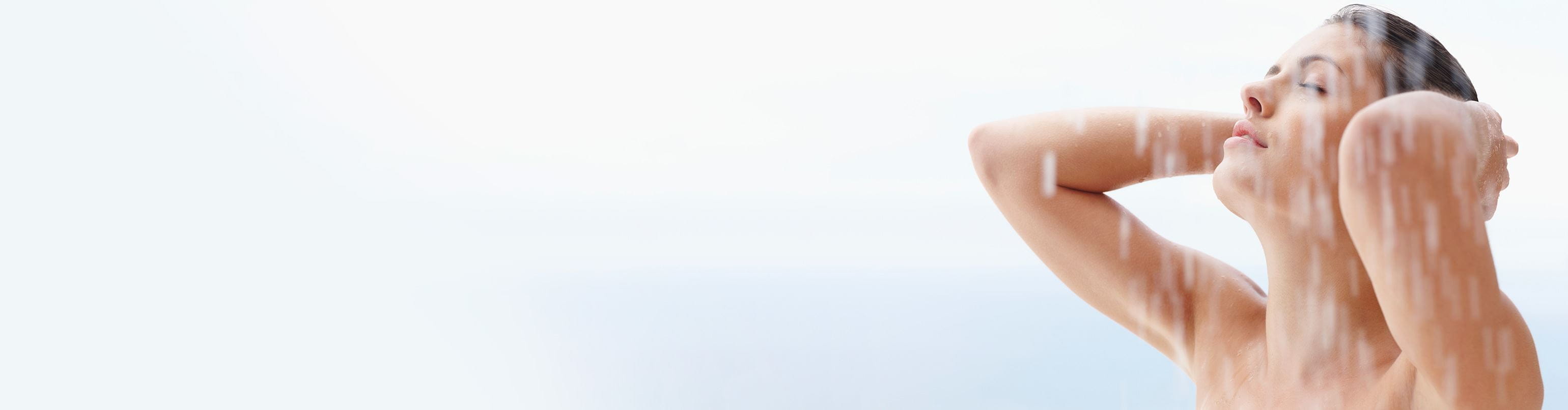 lady with her arms raised in the shower