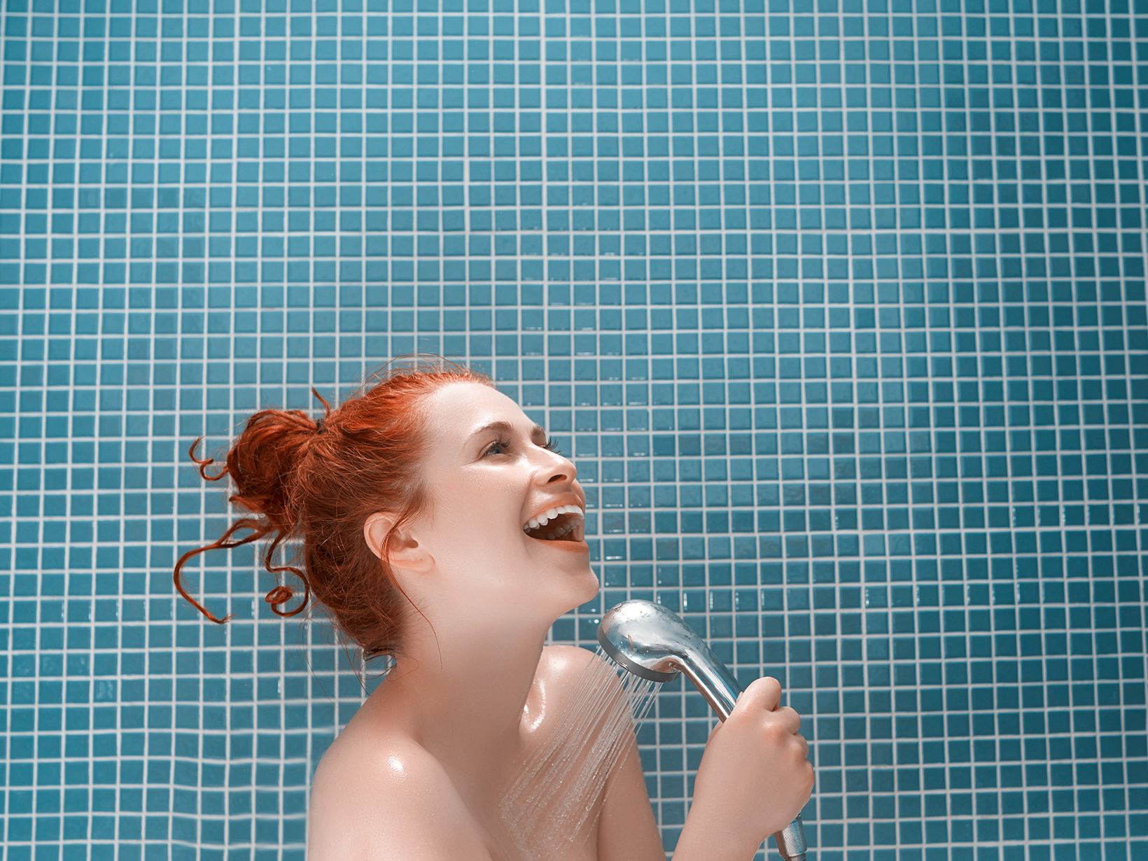 Woman singing in the shower to shower music.